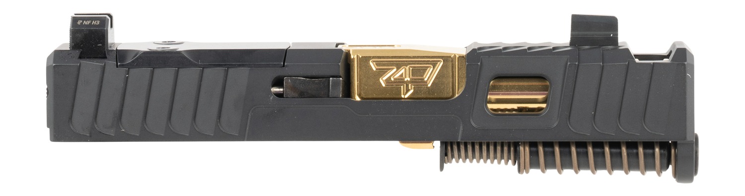 Black pistol slide with gold barrel and spring