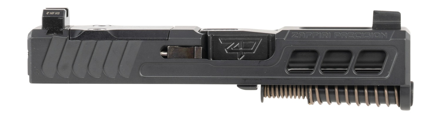 Black pistol slide with barrel and recoil spring