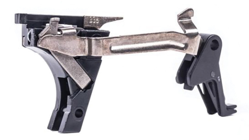 Metal firearm trigger assembly with black components