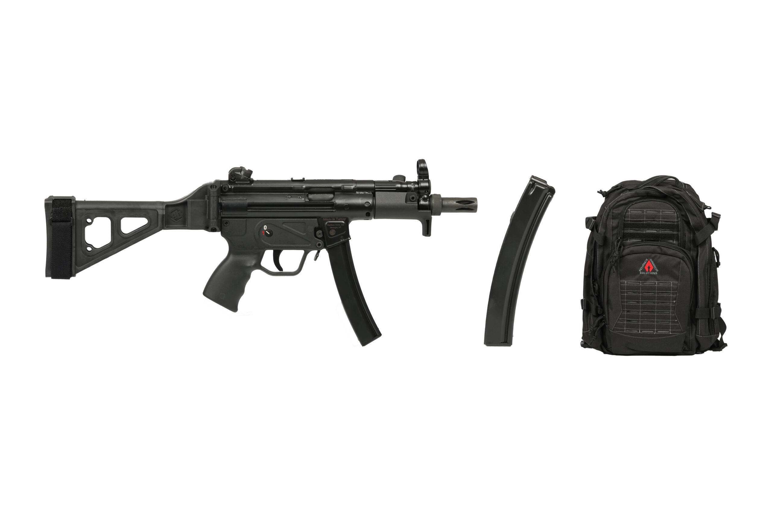 Compact black submachine gun, magazine, and backpack