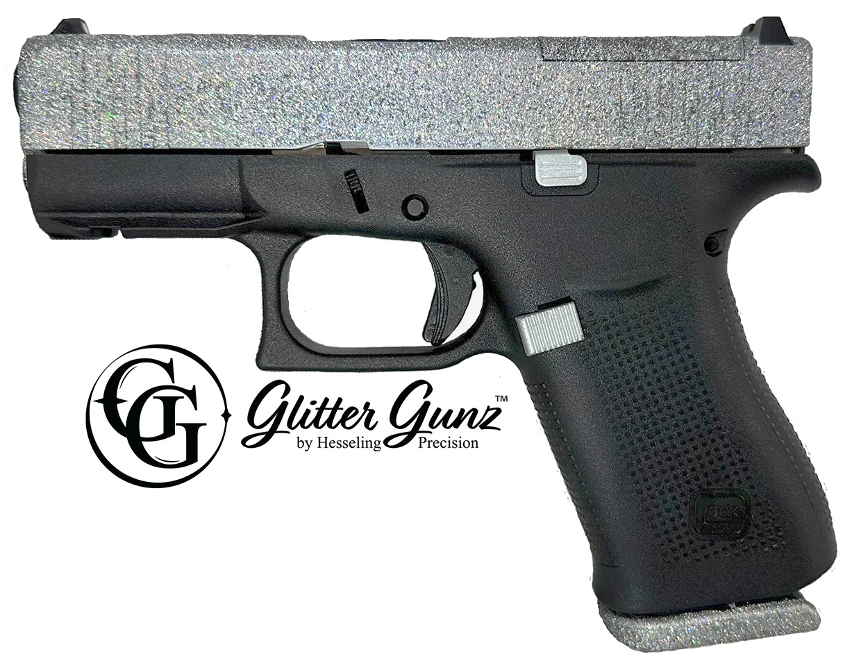 Handgun with glittery silver slide and black grip