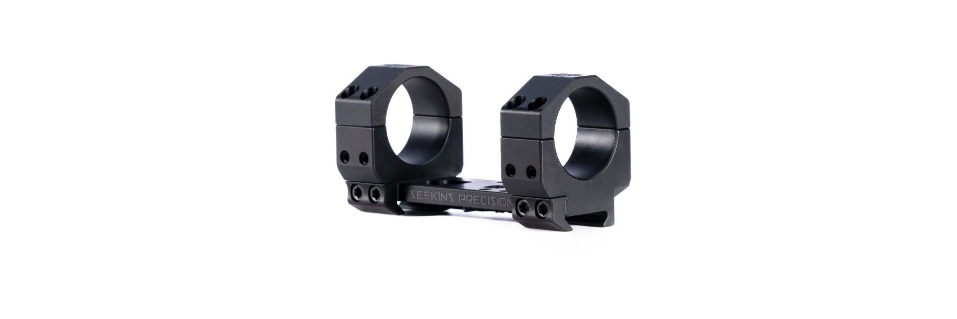 Black one-piece rifle scope mount with rings