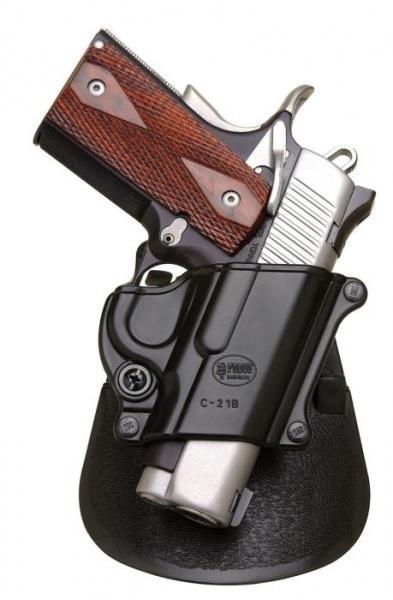 Handgun in black holster on display stand