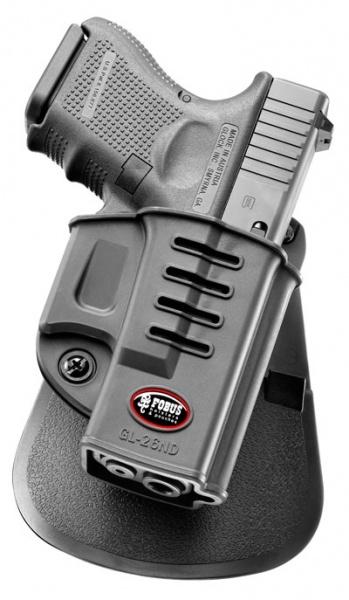 Compact handgun in black holster on display stand