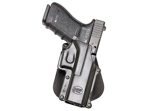 Black semi-automatic pistol in polymer holster