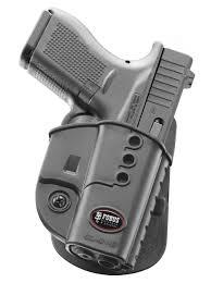 Handgun in tactical holster with mounted flashlight