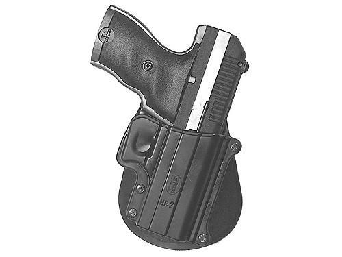 Handgun secured in black belt holster