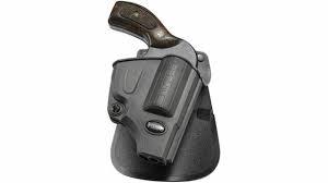 Revolver in black leather holster on white background
