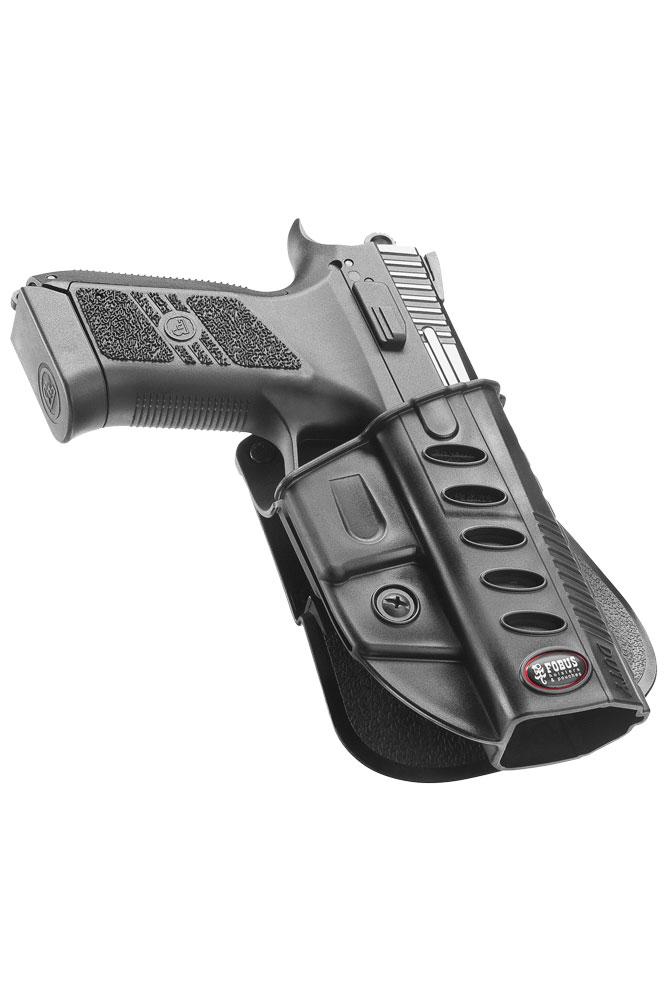 Black handgun in polymer holster on white background