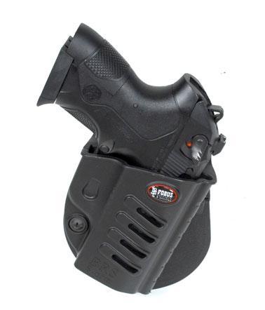 Black handgun in molded belt holster