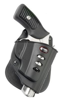 Handgun secured in black tactical holster