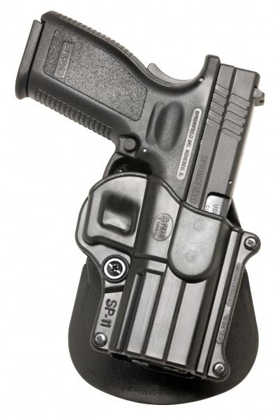 Handgun in black holster on white background