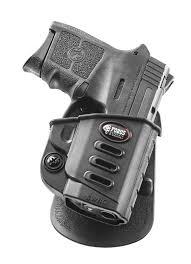 Black handgun in retention holster