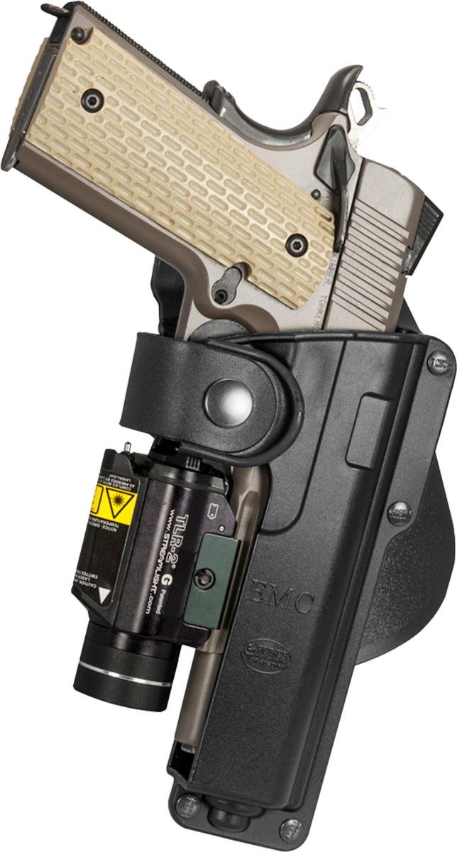 Handgun with laser sight in black holster