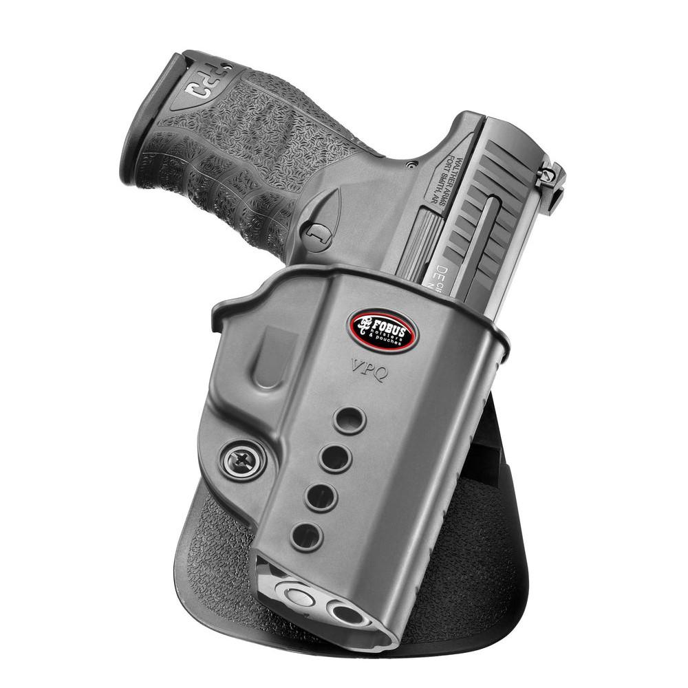 Polymer handgun secured in black belt holster