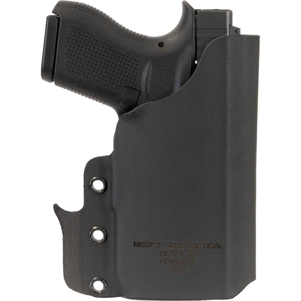 Black handgun in fitted tactical holster