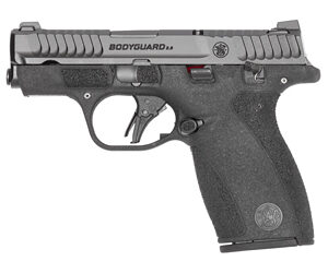 Compact black semi-automatic handgun on white background