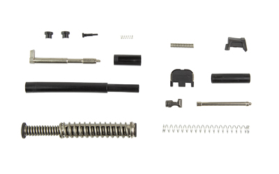 Disassembled handgun parts laid out on white background