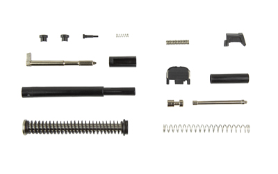 Disassembled handgun parts arranged on white background