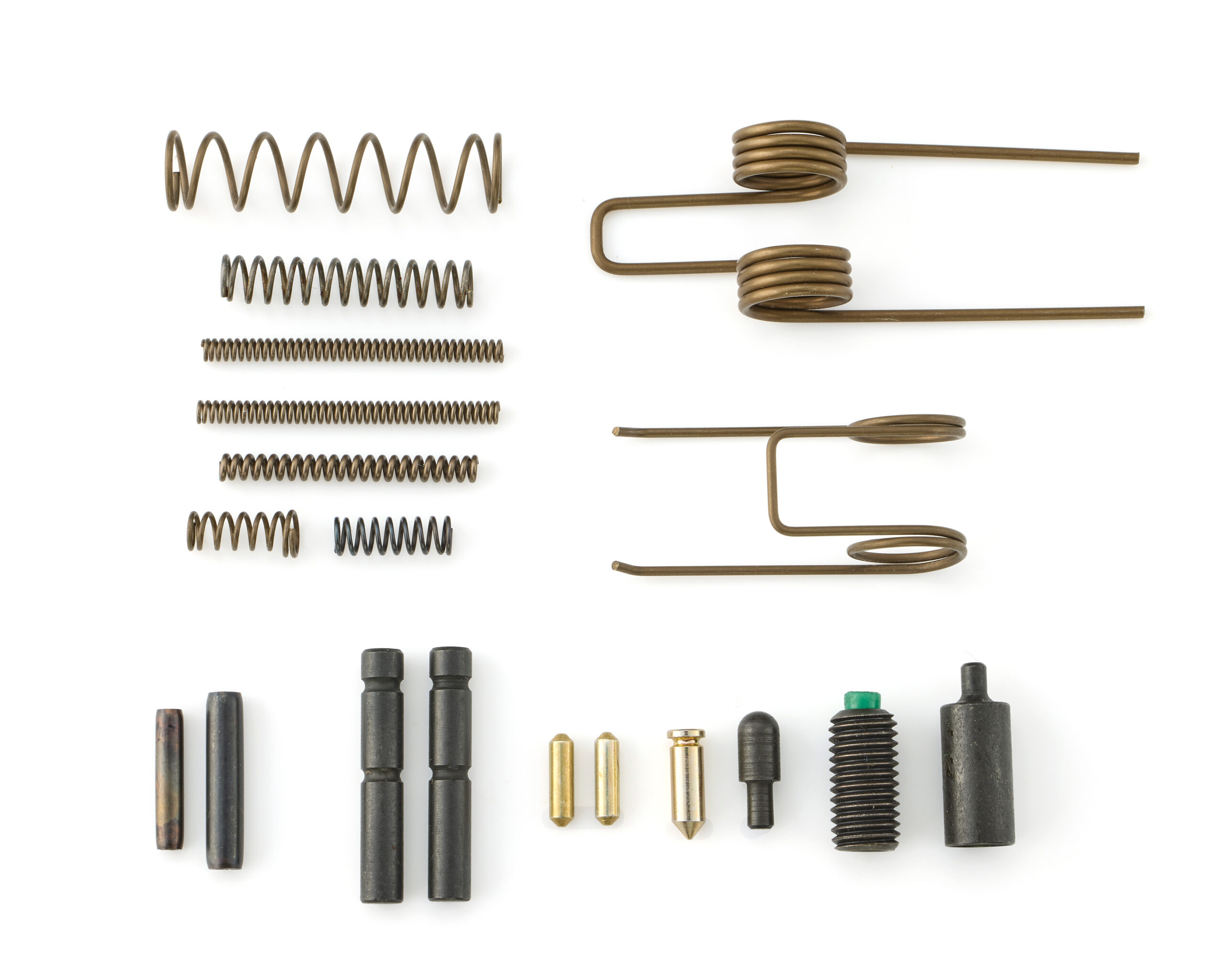 Assorted metal springs and industrial fasteners on white background