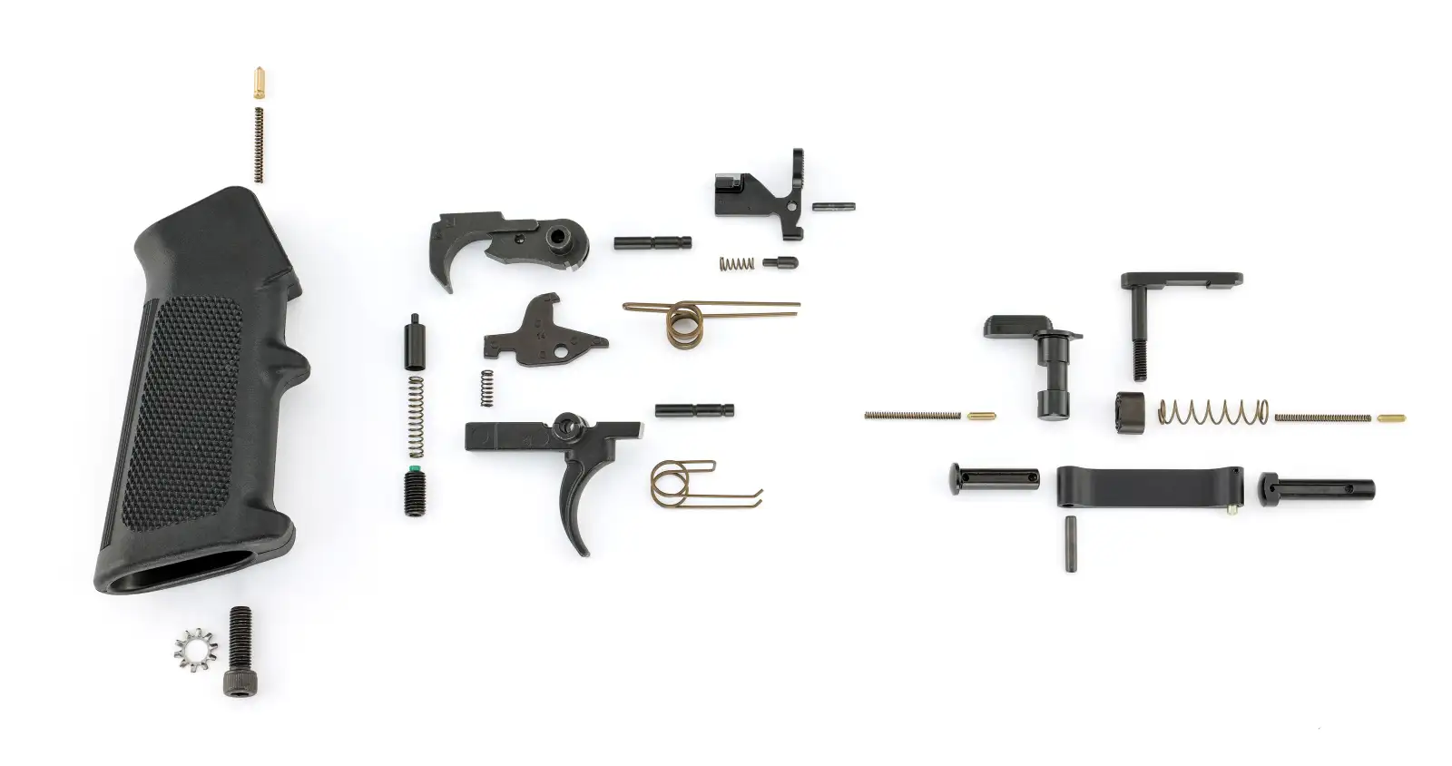 Disassembled firearm parts and grip on white background