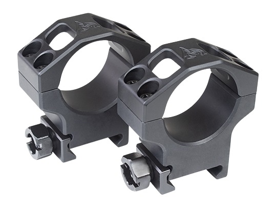 Black aluminum rifle scope rings on white background