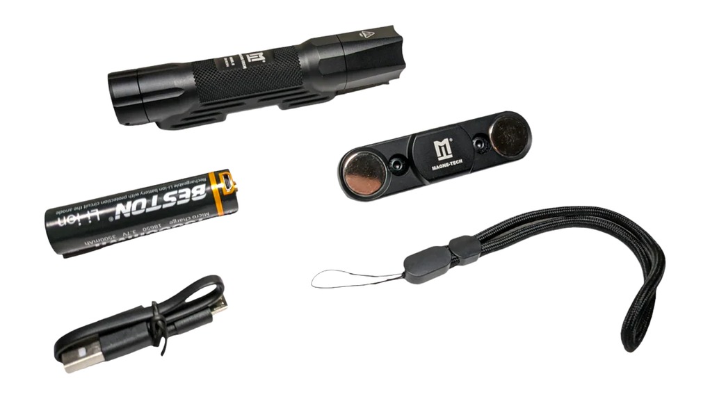 Compact black flashlight kit with accessories