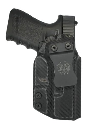 Handgun in black carbon fiber holster