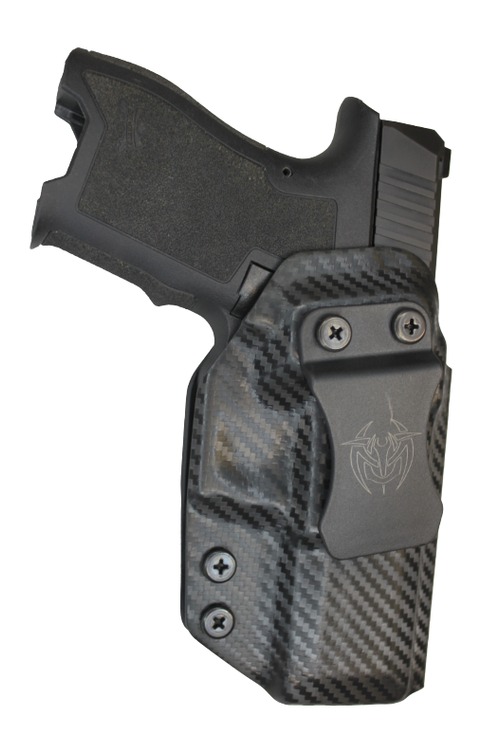 Handgun in carbon fiber holster with belt clip