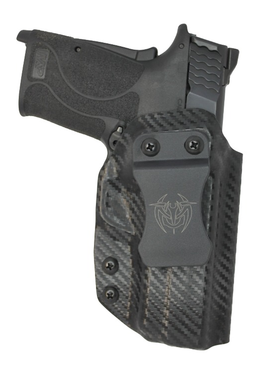Compact handgun in carbon fiber holster