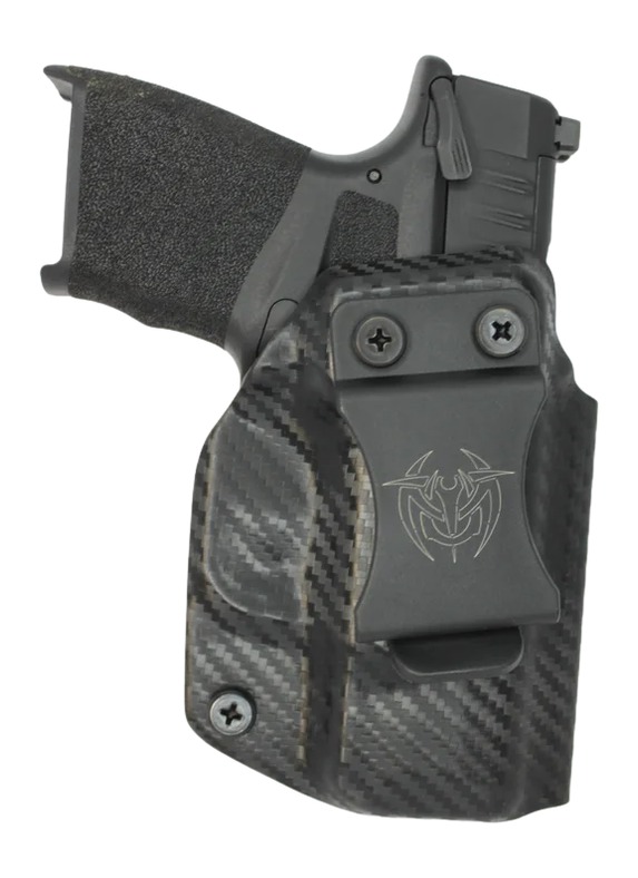Handgun in carbon fiber concealed carry holster