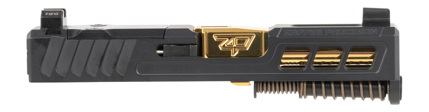 Custom pistol slide with gold barrel and spring