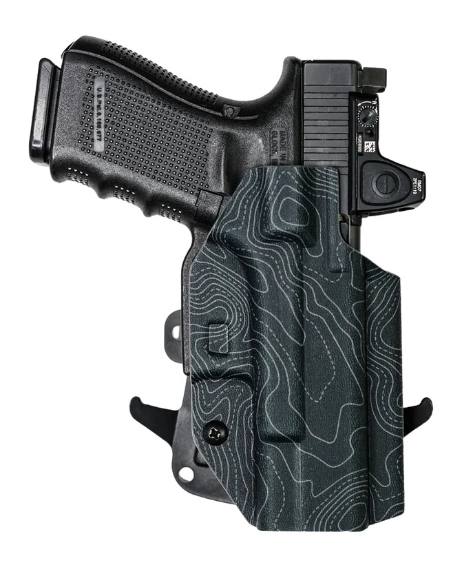 Handgun in patterned holster with red dot sight