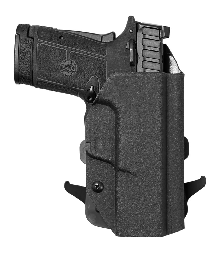 Black handgun in molded holster on white background