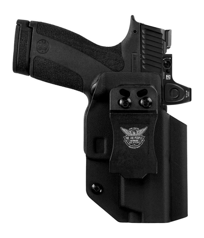 Black handgun in concealed carry holster