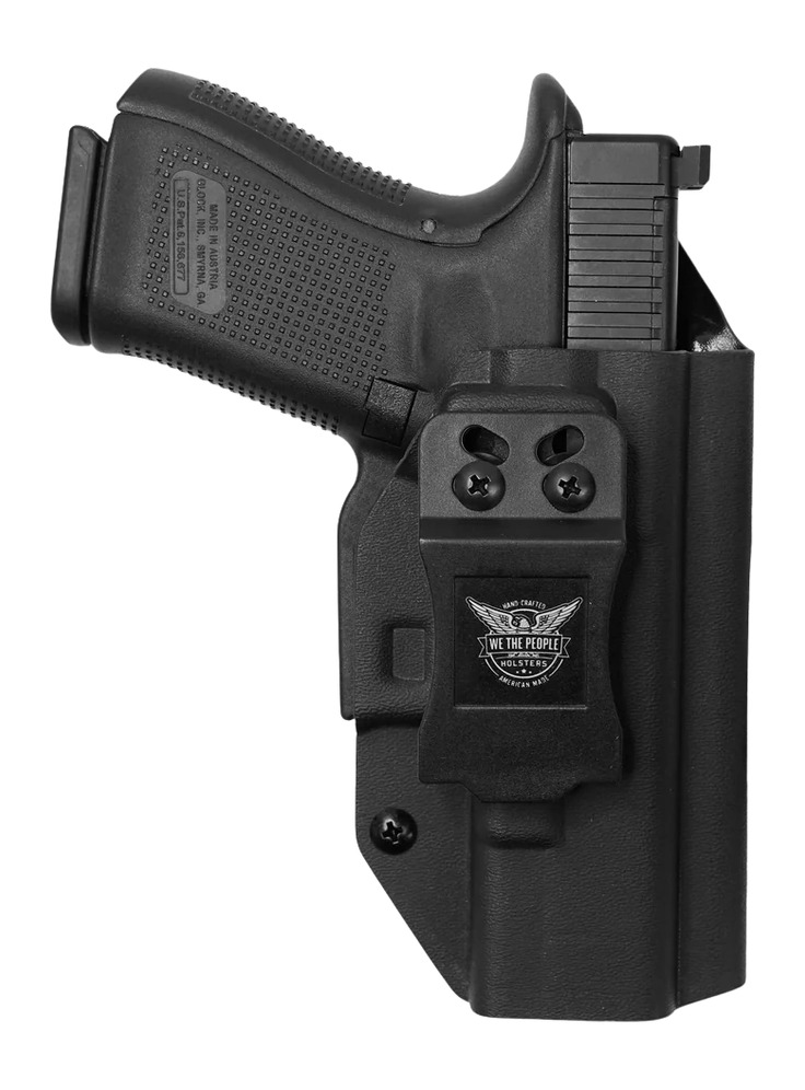 Black handgun in black concealed carry holster