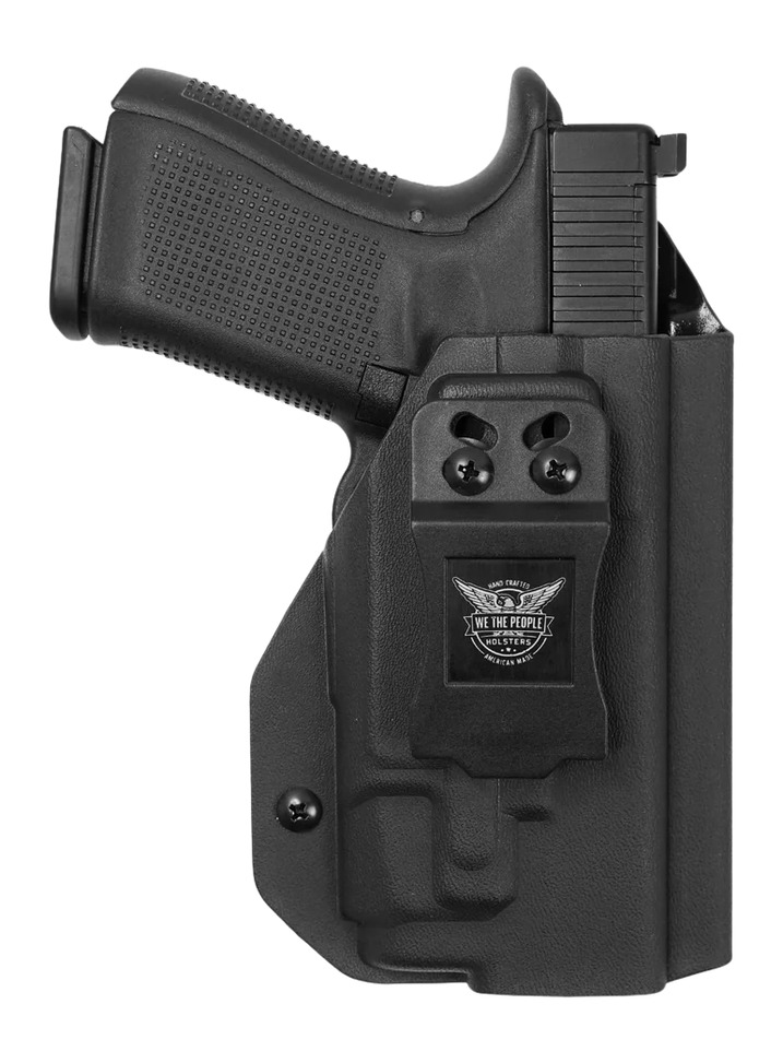 Black handgun in concealed carry holster