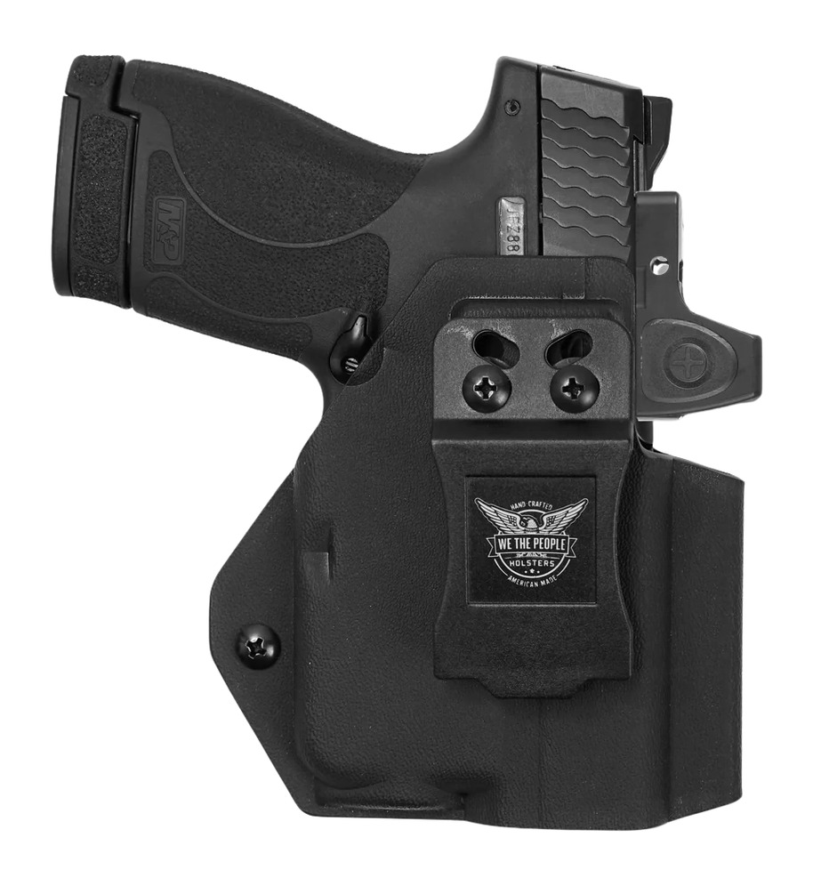 Black handgun in Kydex holster with optic