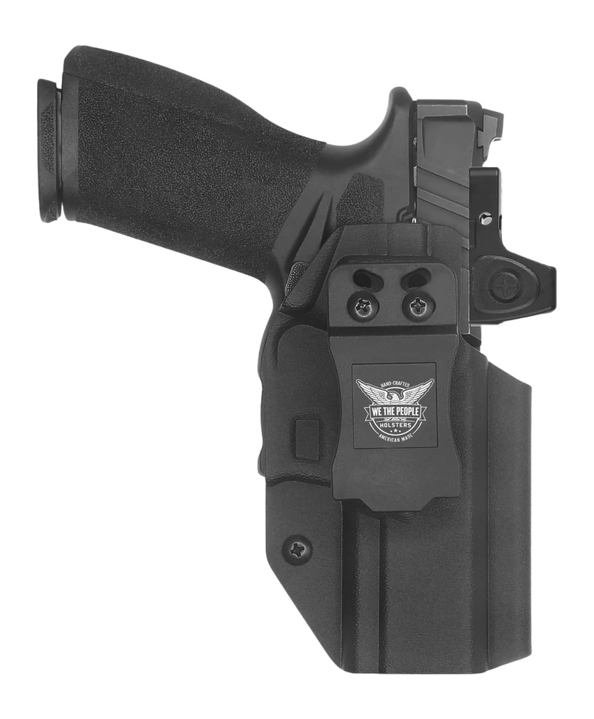 Black handgun in Kydex holster with belt clip