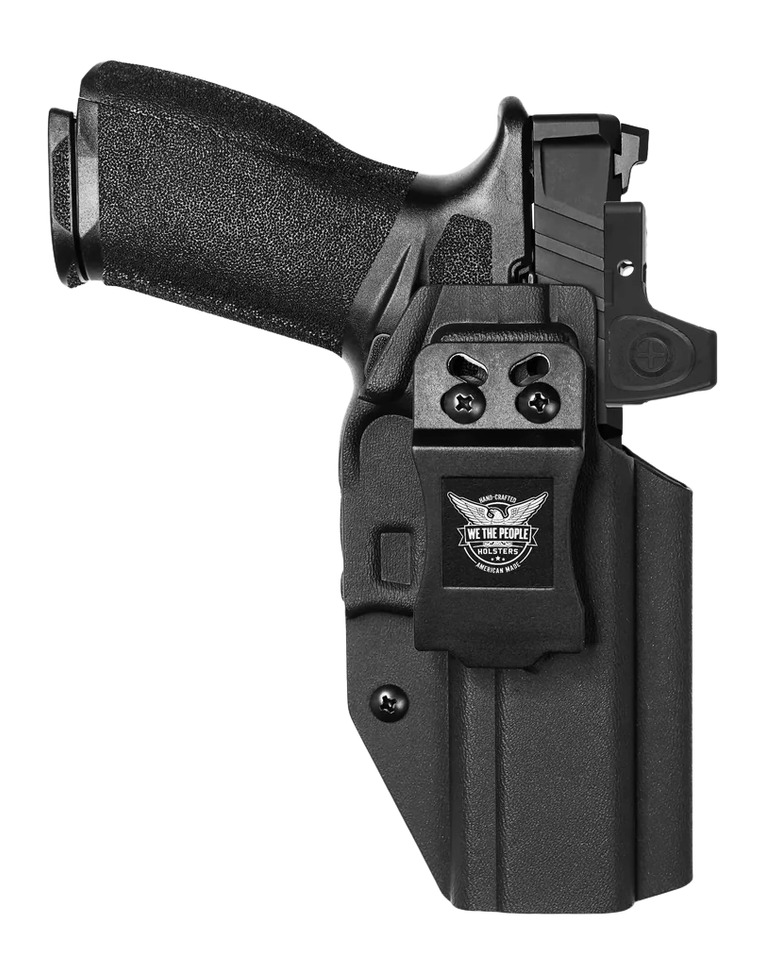 Black handgun in polymer belt holster