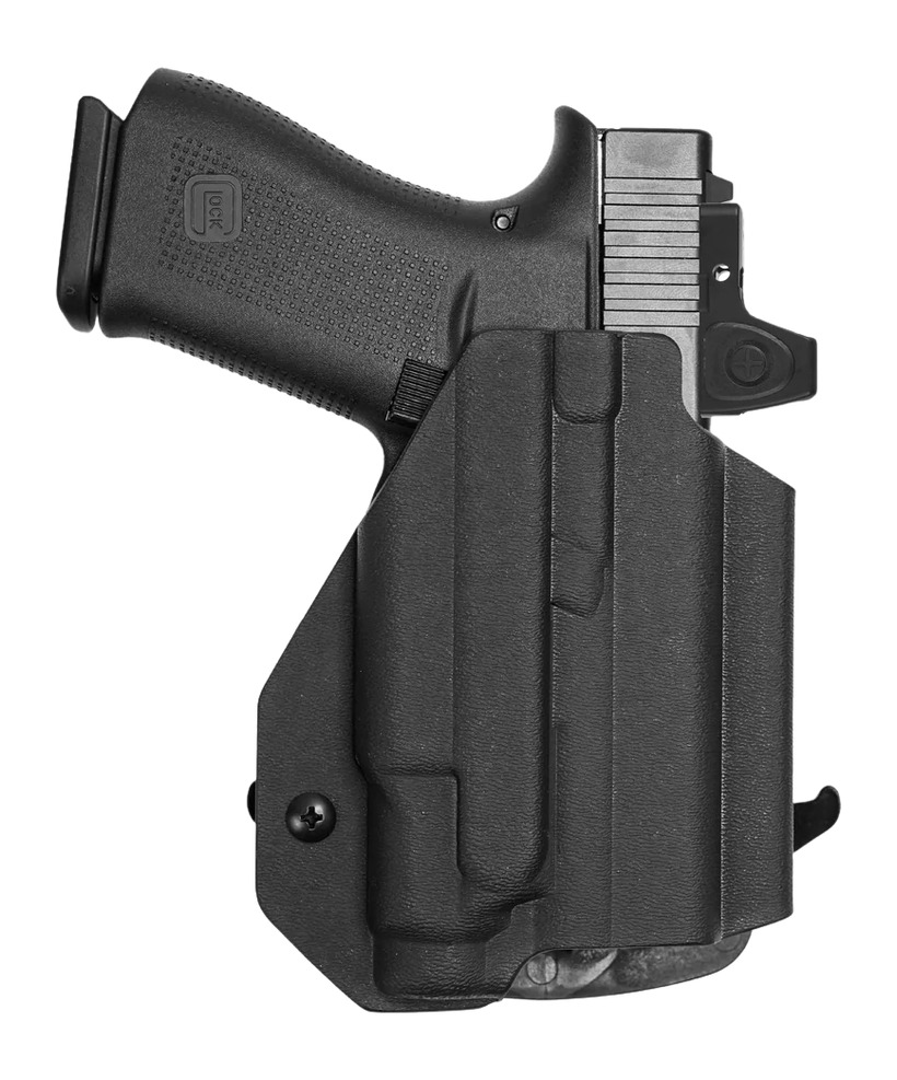 Black handgun in molded polymer holster