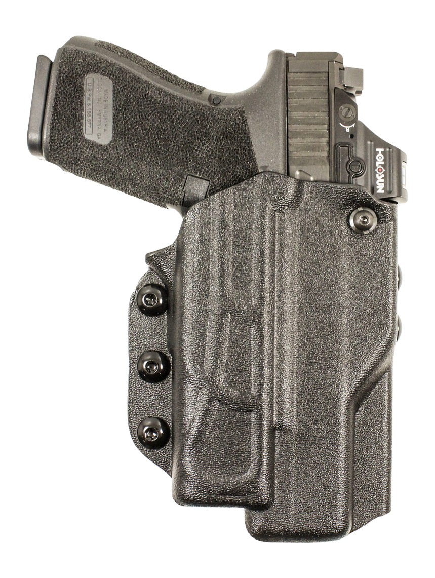Handgun in black Kydex holster with red dot