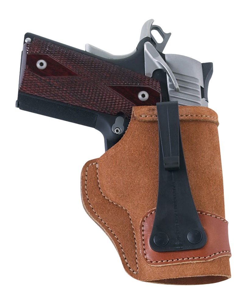Handgun in brown leather holster with clip