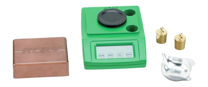 Green digital scale with weights and accessories