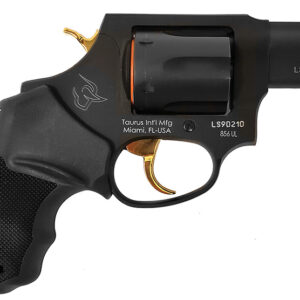 Black Taurus revolver with gold trigger on white background