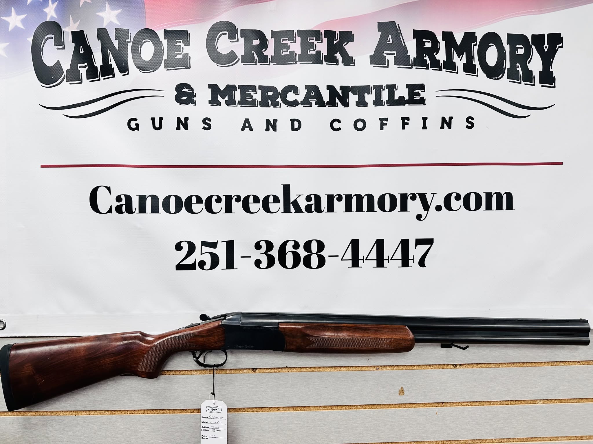 Canoe Creek Armory sign with shotgun display