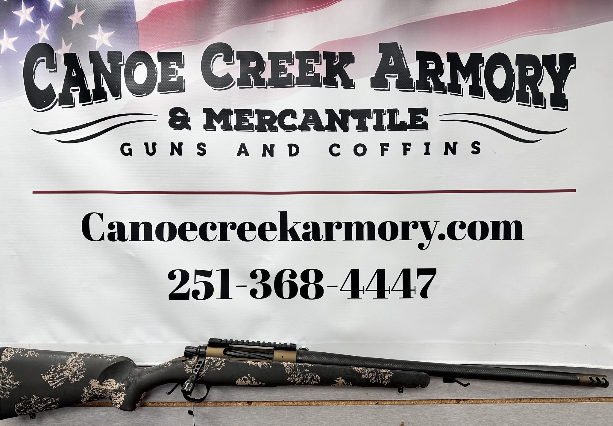 Canoe Creek Armory sign with rifle display
