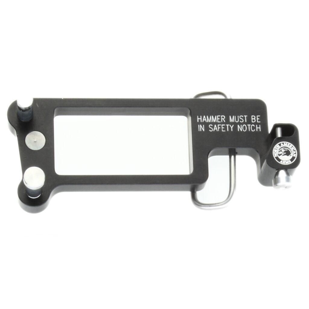 Black metal firearm accessory with safety warning text