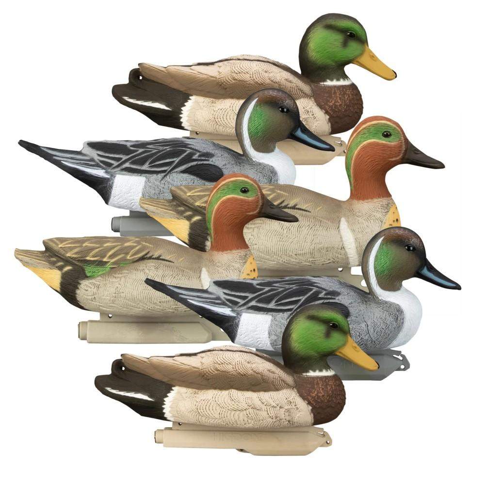Stacked realistic duck hunting decoys on white background