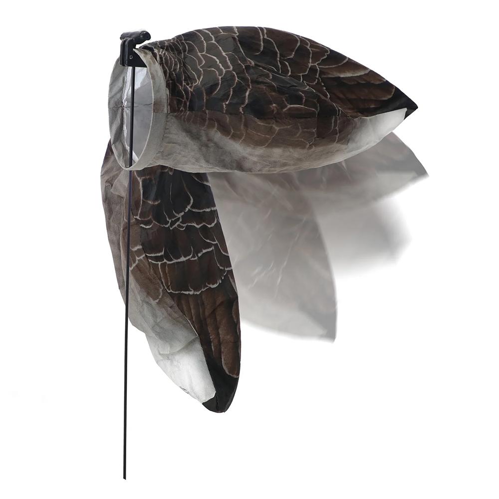 Realistic flying bird decoy mounted on pole